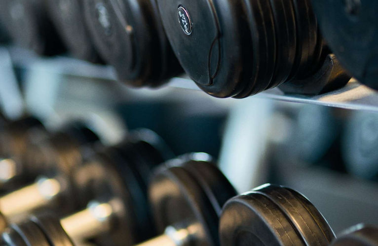 Dumbbells racked in a training studio
